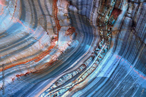 Colorful stratified rock formations in natural setting photo
