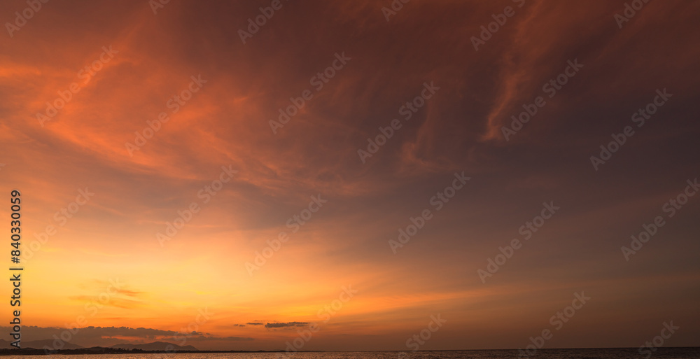 Sunset Sky clouds over Horizon sea landscape in the Evening Summer season background, Dramatic Orange, Yellow sunlight fluffy after sundown on twilight, Dusk sky backgrounds Sunset Sky clouds over Horizon sea landscape in the Evening Summer season background, Dramatic Orange, Yellow sunlight fluffy after sundown on twilight, Dusk sky backgrounds