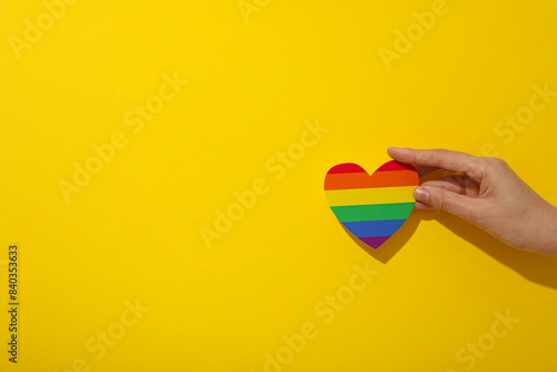LGBT parade concept  free love symbol on yellow background.