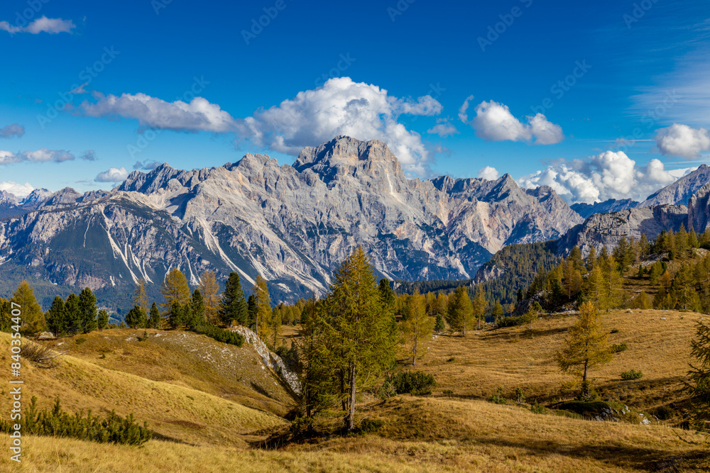Dolomites mountains, Alpi Dolomiti beautiful scenic landscape in summer. Italian Alps mountain summits and rocky tower peaks above green valley alpine scene near Cortina'd'Amprezzo Dolomites mountains, Alpi Dolomiti beautiful scenic landscape in summer. Italian Alps mountain summits and rocky tower peaks above green valley alpine scene near Cortina'd'Amprezzo