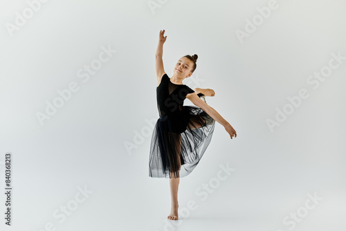 Wallpaper Mural A young girl with a prosthetic leg demonstrates her talent in ballet by gracefully executing a turn. Torontodigital.ca