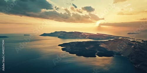 A serene sunset scene with the sun dipping below the horizon over a calm body of water