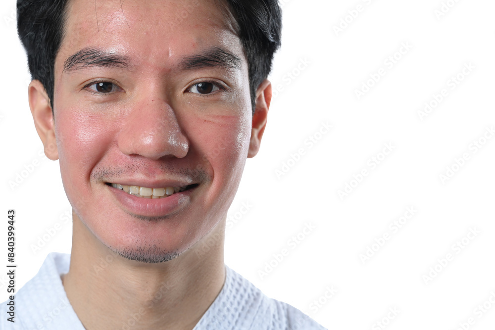 Fototapeta premium Smiling man after facial laser treatment on white background. Aesthetic face treatment concept