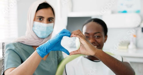 Woman  dentist and face with hands in heart shape for love or happiness for teeth result  tooth doctor and patient with gesture for support. Orthodontist  client and together for oral care with emoji