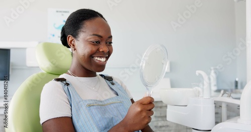Happy, black woman and dental teeth with mirror for clean mouth, oral or gum care at dentist. Young African female person with big smile for tooth whitening, hygiene or healthcare with reflection