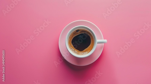 A white coffee cup on a pink background...