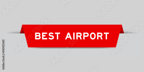 Red color inserted label with word best airport on gray background