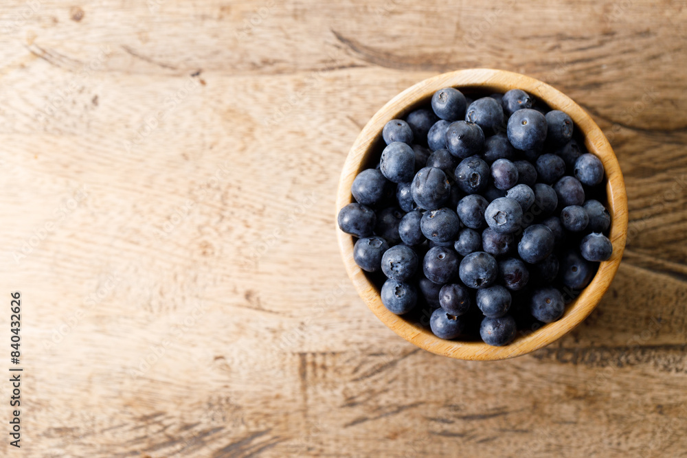 Ripe organic blueberries on wooden table background. Selective focus. Ripe organic blueberries on wooden table background. Selective focus.