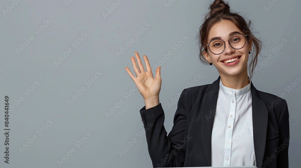 Happy businesswoman with a laptop waving her hand. Happy businesswoman with a laptop waving her hand.