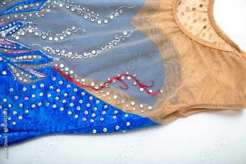 Blue velvet rhythmic gymnastics leotard on white background