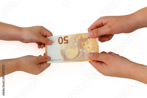 Two pairs of hands are pulling money, 50 euro banknotes, struggle because of money. 