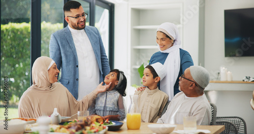 Islamic  family and dinner in home for ramadan  muslim celebration and food on dining table. Eid mubarak  culture and religious gathering with grandparents  children and mom or dad for bonding