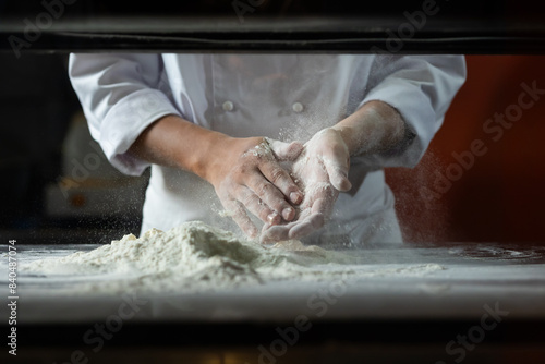 Tableau sur toile experienced chef - Professional chef prepares the dough with flour to make pizza