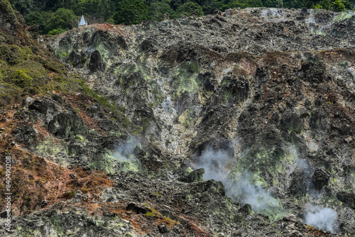 Steaming volcanic fumarole field at Bukit Kasih, a tourist park with a world peace themed tower and worship houses of five major religions, Bukit Kasih, Minahasa, North Sulawesi, Indonesia photo