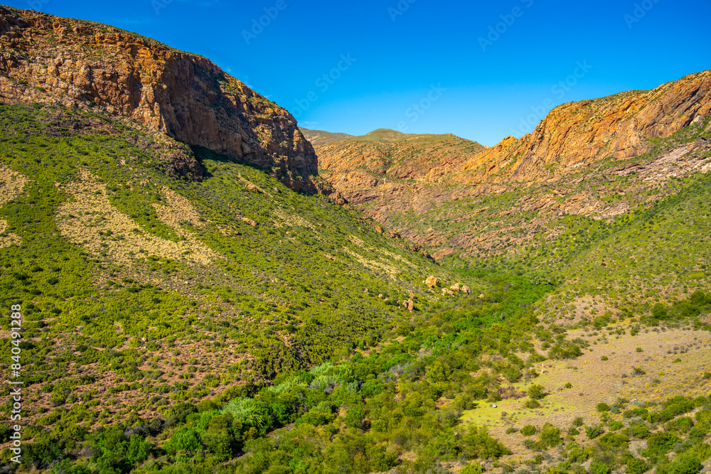 View of green mountainous landscape between Zoar and Calitzdorp View of green mountainous landscape between Zoar and Calitzdorp