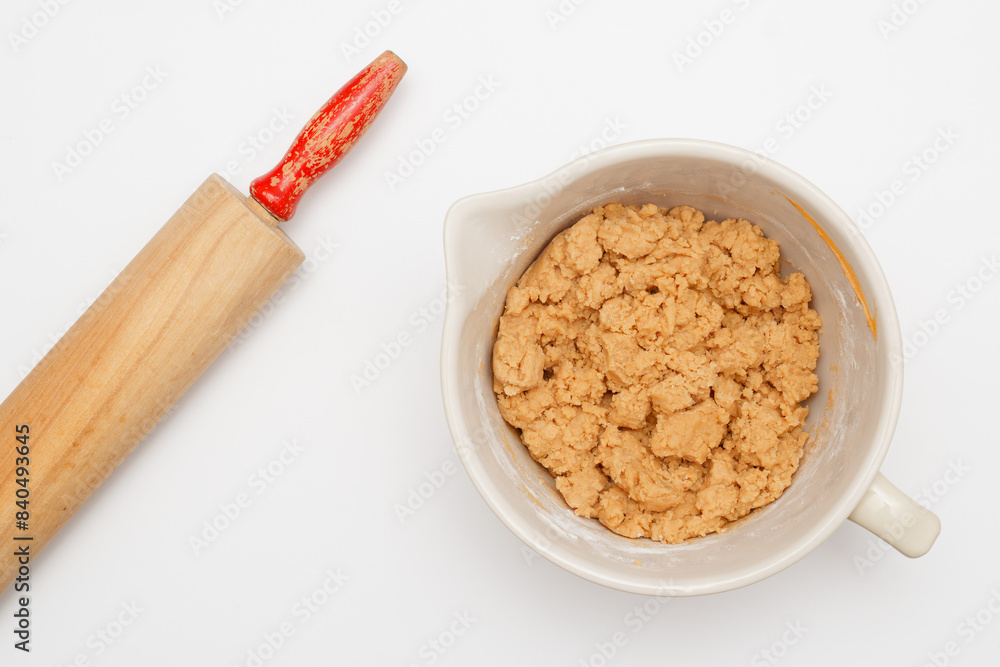 Overhead shot of peanut butter cookie dough and rolling pin Overhead shot of peanut butter cookie dough and rolling pin