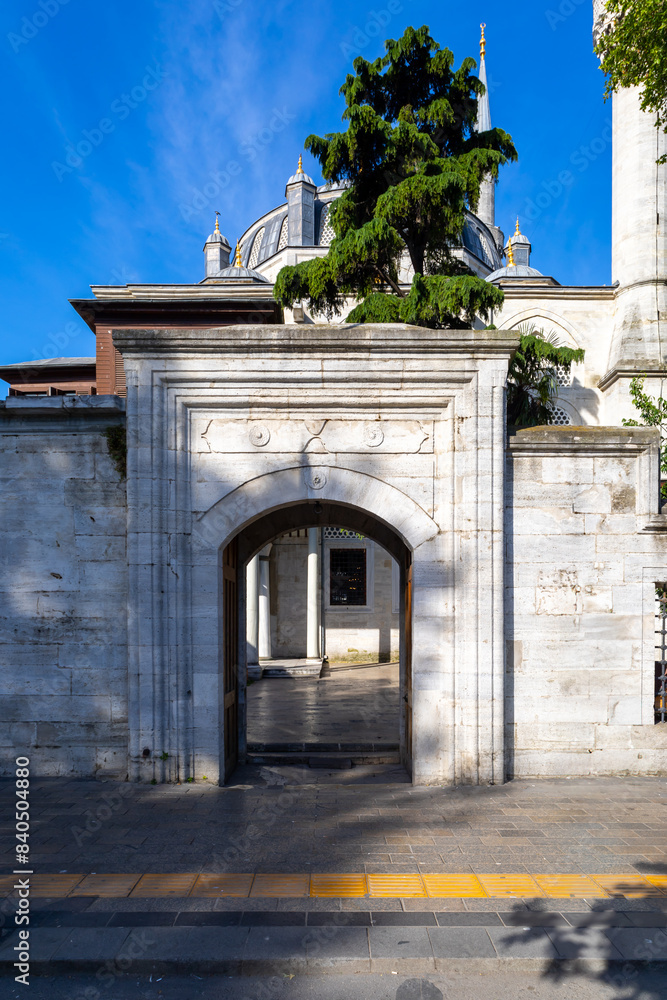 Fototapeta premium Exterior view of Yeni Valide Mosque in Uskudar, Istanbul, Turkey on June 2, 2024. The Yeni Valide Mosque is an 18th century Ottoman mosque which was built by Sultan Ahmed III