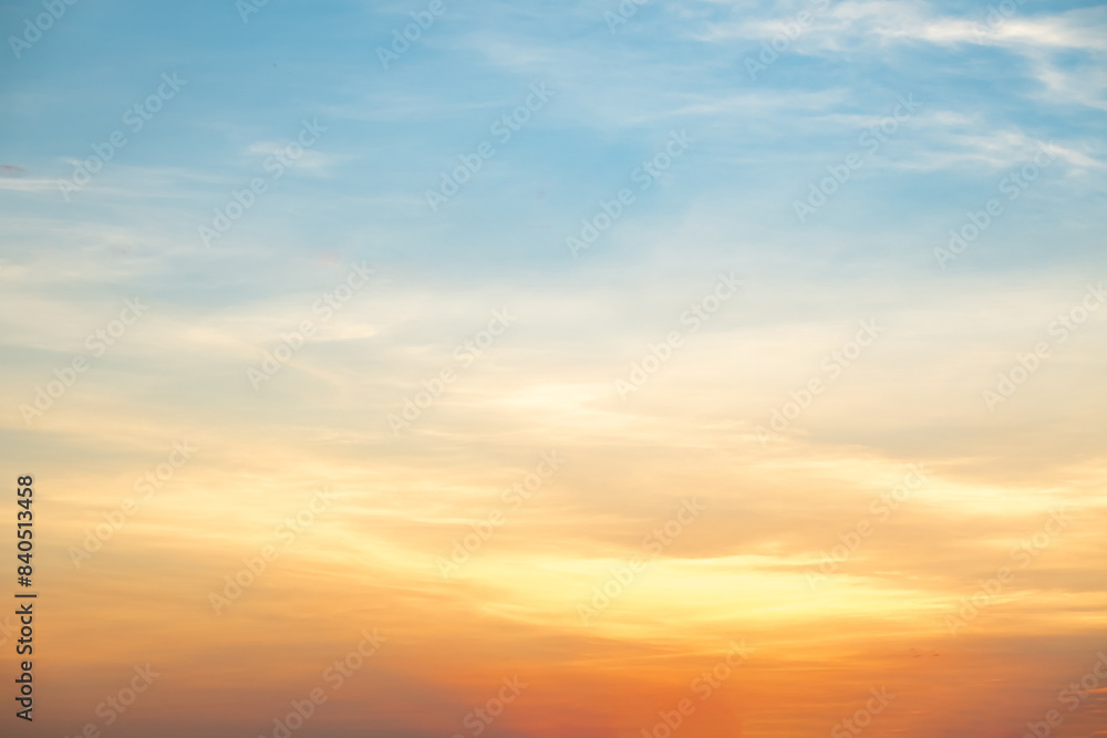 Obraz premium Beautiful , luxury soft gradient orange gold clouds and sunlight on the blue sky perfect for the background, take in everning,Twilight, Large size, high definition landscape photo