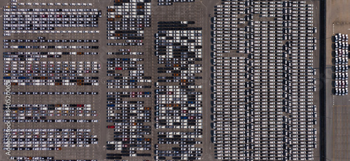 Top view of the electric vehicle transport yard and intercontinental shipping industry.	