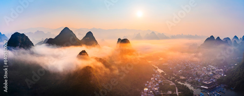 Aerial photography of beautiful karst mountains and clouds nature landscape at sunrise in Guilin, China. Panoramic view. photo