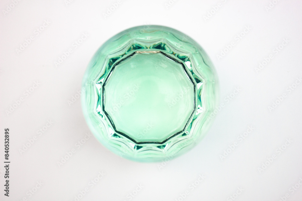 Naklejka premium Glass glass glass with turquoise,light green, drink. Alcoholic drink on isolated background, top view.