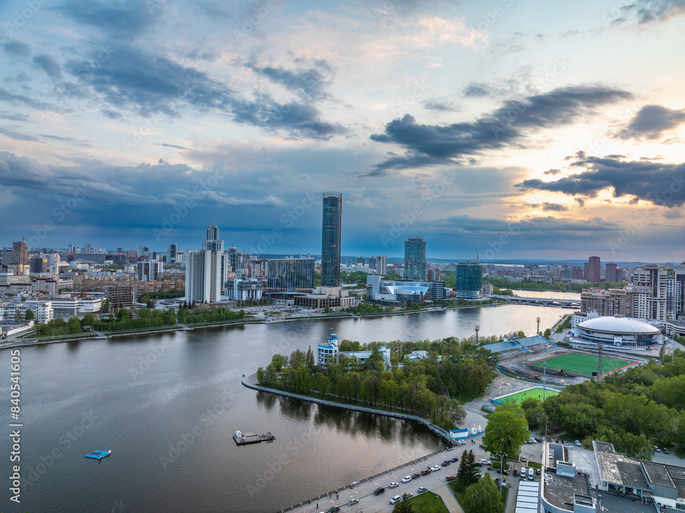 Naklejka premium Yekaterinburg city with Buildings of Regional Government and Parliament, Dramatic Theatre, Iset Tower, Yeltsin Center, panoramic view at summer sunset.