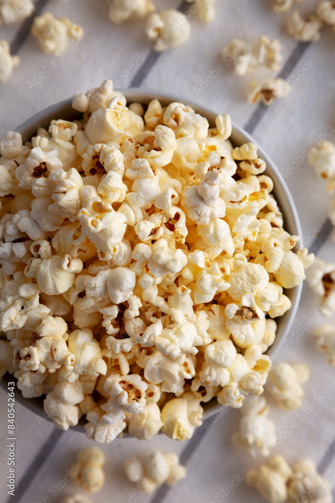White Buttered Popcorn with Salt in a Bowl, top view. White Buttered Popcorn with Salt in a Bowl, top view.