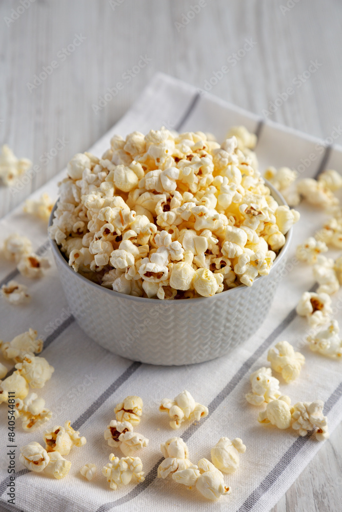 White Buttered Popcorn with Salt in a Bowl, side view. White Buttered Popcorn with Salt in a Bowl, side view.