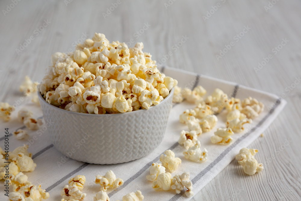 White Buttered Popcorn with Salt in a Bowl, side view. White Buttered Popcorn with Salt in a Bowl, side view.