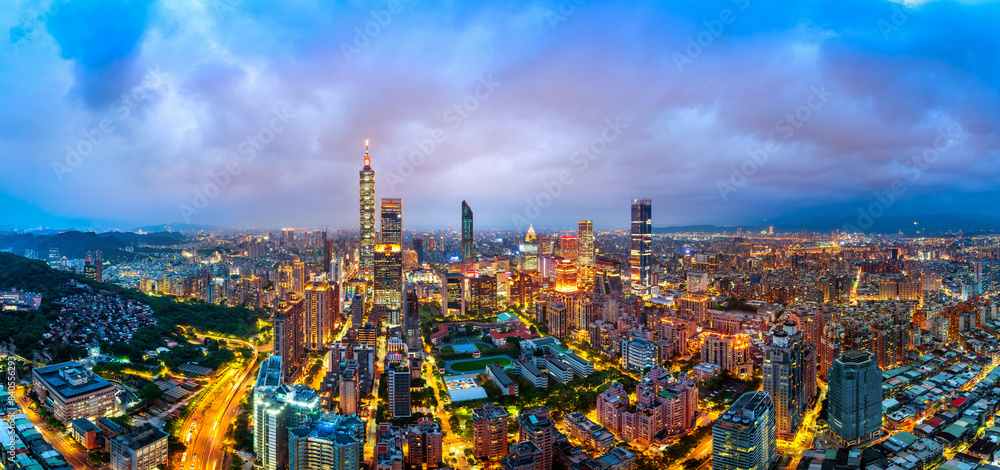 Naklejka premium Panorama of cityscape and traffic at night in Taipei, Taiwan.