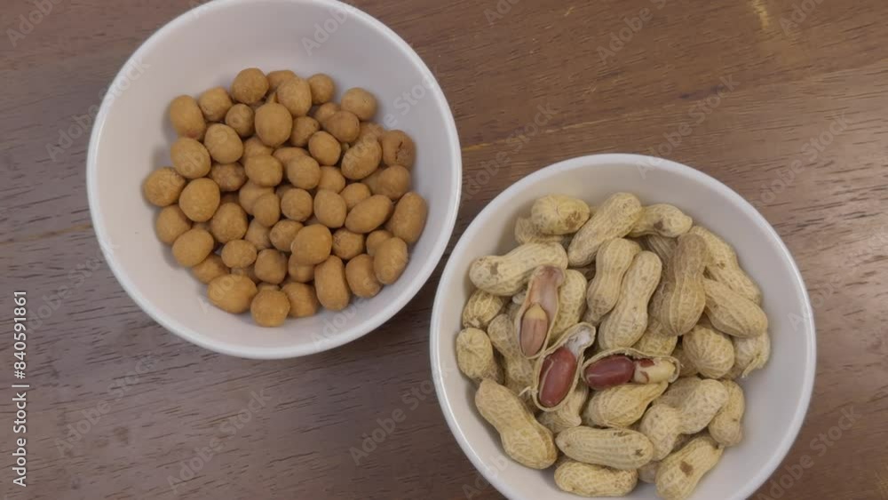 two bowls of peanut and peanut snack two bowls of peanut and peanut snack