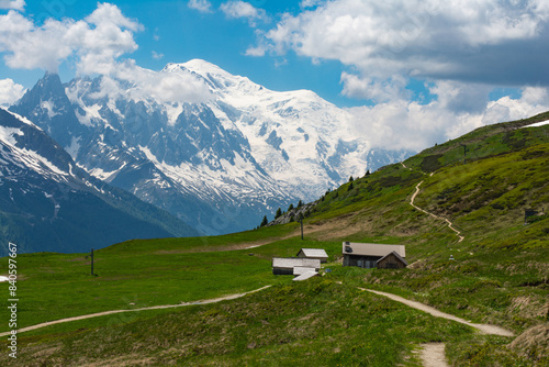 Picturesque panoramic view of the snowy Alps mountains and meadows while hiking Tour du Mont Blanc. Popular hiking route. Alps  Chamonix-Mont-Blanc region  France  Europe.