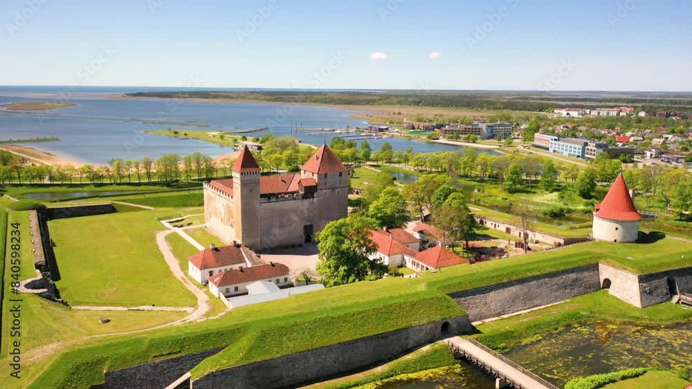 4K panoramic aerial video from flying drone to Kuressaare (Arensburg) Episcopal Castle a sunny summer day.Kuressaare in the Baltic sea,Saaremaa island, Saare County, Estonia. 4K panoramic aerial video from flying drone to Kuressaare (Arensburg) Episcopal Castle a sunny summer day.Kuressaare in the Baltic sea,Saaremaa island, Saare County, Estonia.