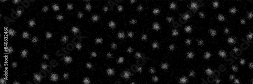 Pet hairballs and loose lint in a seamless pattern on black fabric. Texture of white animal fur on a dark bg. Close-up of pet hair on clothing. Traces of rabbit or dog shedding on textiles