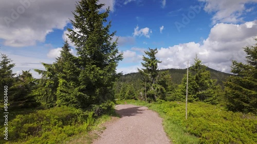 Walking at top of Medvedin hill at Krkonose Giant Mountains national park, Czech Republic. View POV of tourist perspective. Hiking near Spindleruv Mlyn town. photo