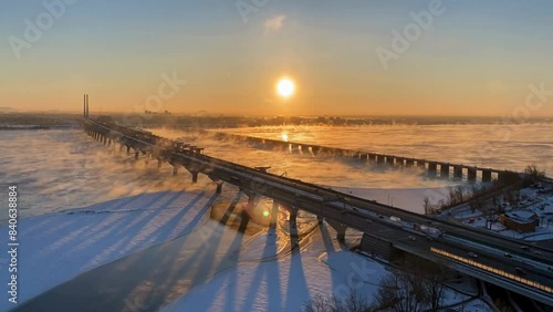 Golden Winter Sunrise Over Bridge with Misty Air