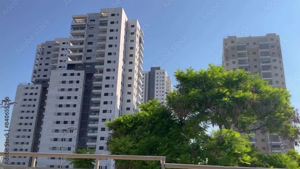 High-rise residential buildings near a park and a picturesque pond. An ideal place to live, a modern, prosperous area. Luxury real estate. High-rise residential buildings near a park and a picturesque pond. An ideal place to live, a modern, prosperous area. Luxury real estate.
