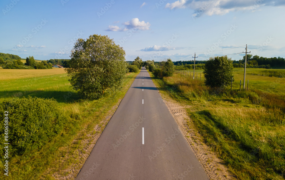 Fototapeta premium View of the fields and roads from the height of a flying drone. 