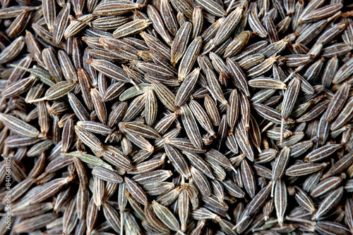 Obraz na plátne Pile and left side view of cumin seeds with close-up shot