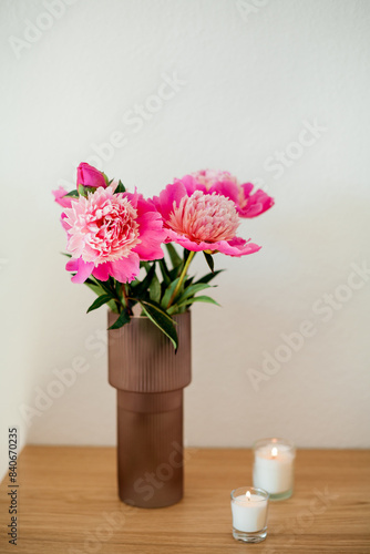 Wallpaper Mural Bouquet of peonies in glass pink vase on wooden table. Spring flowers. Torontodigital.ca