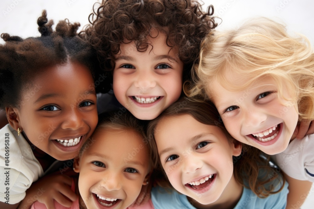 A group of smiling children pose together for a photo, with no specific occasion or event in sight A group of smiling children pose together for a photo, with no specific occasion or event in sight