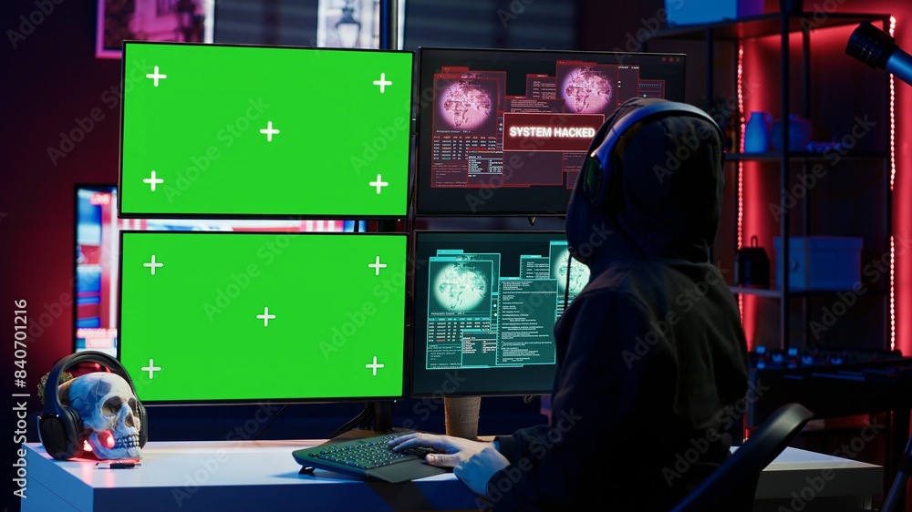 Fototapeta premium Happy man writing code on green screen PC, celebrating after managing to get past security systems. Joyous hacker feeling proud after breaching firewall using mockup computer, camera A