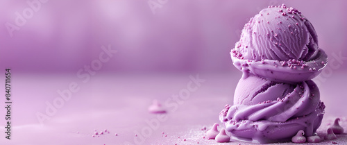 Balls of lavender ice cream on a purple background