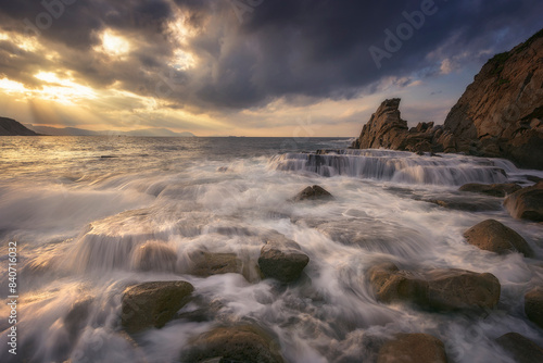 Sunset with dramatic sky on Azkorri beach, Getxo