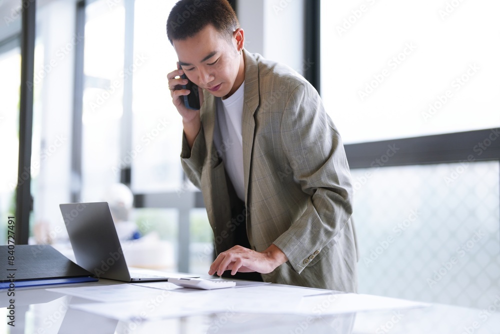 asian business man holding Smartphone working mobile devices. cell telephone technology e-commerce smartphone for business asian business man holding Smartphone working mobile devices. cell telephone technology e-commerce smartphone for business