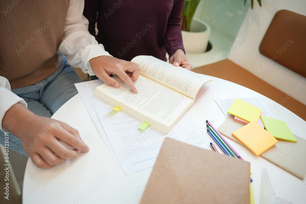 Learning with friends Young students campus.High School Tutor for examining helps school homework together with friend catching up and learning Learning with friends Young students campus.High School Tutor for examining helps school homework together with friend catching up and learning