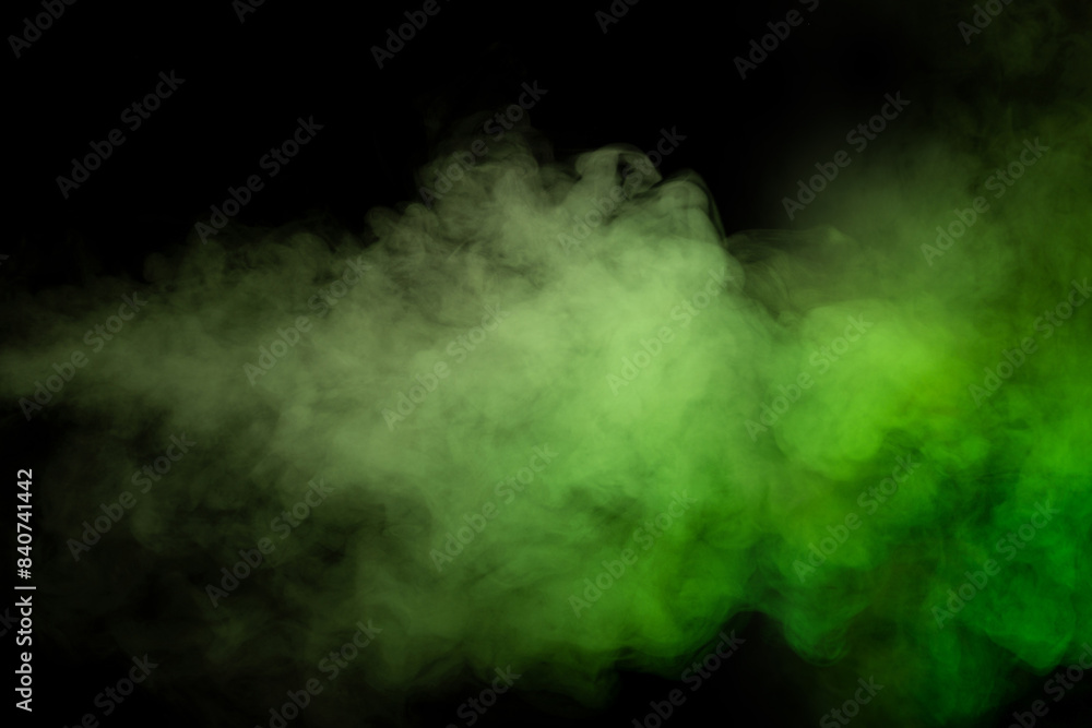 Obraz premium Green and white steam on a black background.