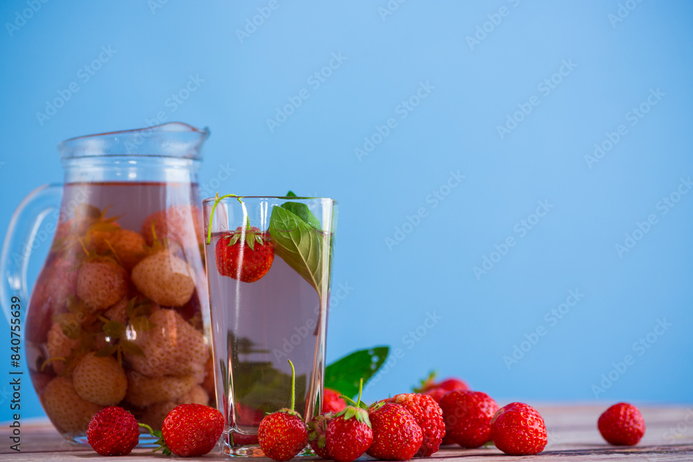 Sweet refreshing berry compote of ripe strawberries in a decanter Sweet refreshing berry compote of ripe strawberries in a decanter