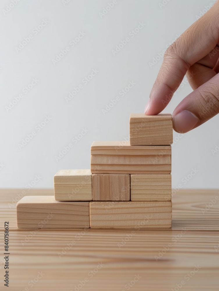 Hand arranging wood block stacking as step stair. Ladder career path concept for business growth success process, Copy space hyper realistic Hand arranging wood block stacking as step stair. Ladder career path concept for business growth success process, Copy space hyper realistic