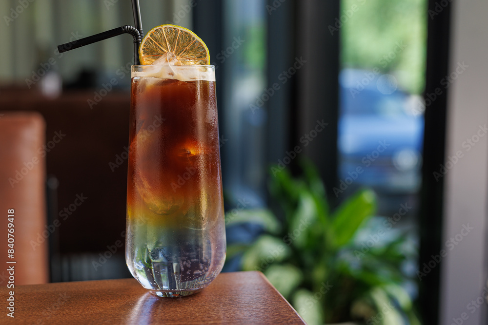 cold refreshing ice coffee in a transparent glass on a wooden table cold refreshing ice coffee in a transparent glass on a wooden table